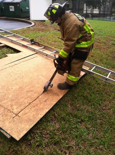 Cutting wood with a chainsaw